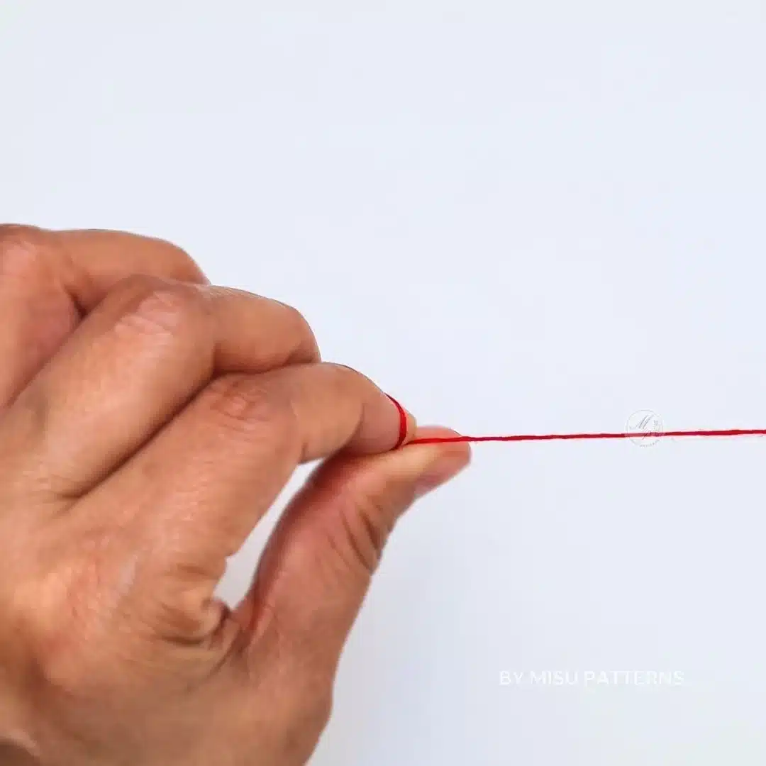Wrap the thread around your finger once and gently roll it between your fingers.