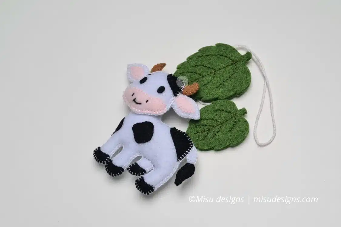 Handmade garland cow with leaf and sunflower, white cow with black spots