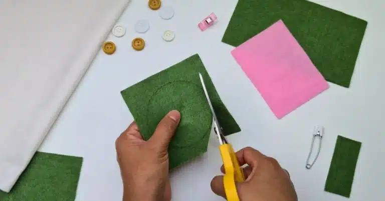cutting felt into a circle shape with sharp scissors