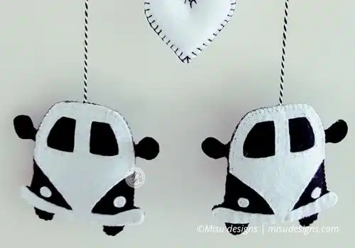 Front view of handmade felt Volkswagen Kombi with two combis and heart, nursery decor